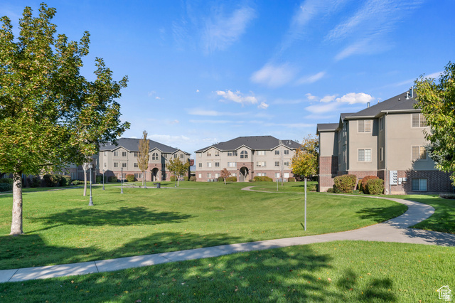 1768 West 1300th Street South, Unit 305 Springville, UT 84663 - Photo 24 of 26 Surrounding community featuring a grassy common areas.