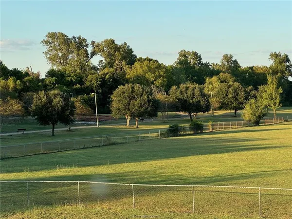 a view of a house in a big yard