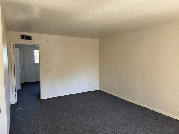 an empty room with a hallway