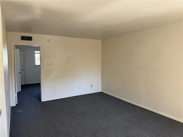 an empty room with a hallway