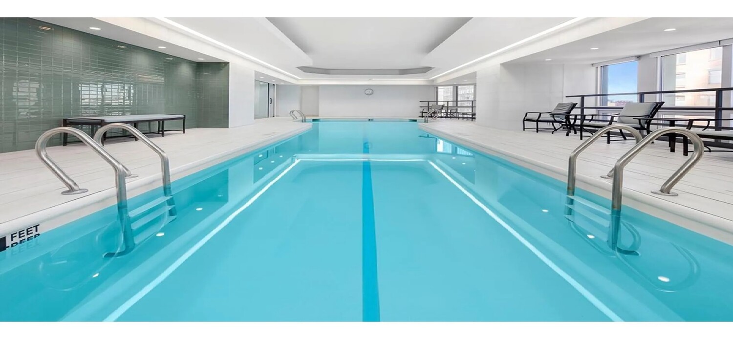 150 West 56th Street, Unit 4003 Manhattan, NY 10019 - Photo 8 of 11 a view of a kitchen with furniture and a potted plant