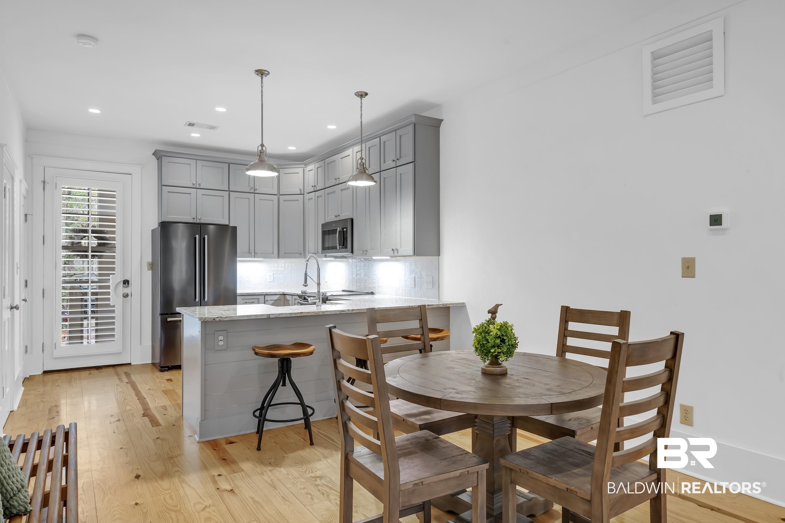 25773 Canal Road, Unit 32 Orange Beach, AL 36561 - Photo 8 of 35 Dining area featuring light wood-style floors and recessed lighting