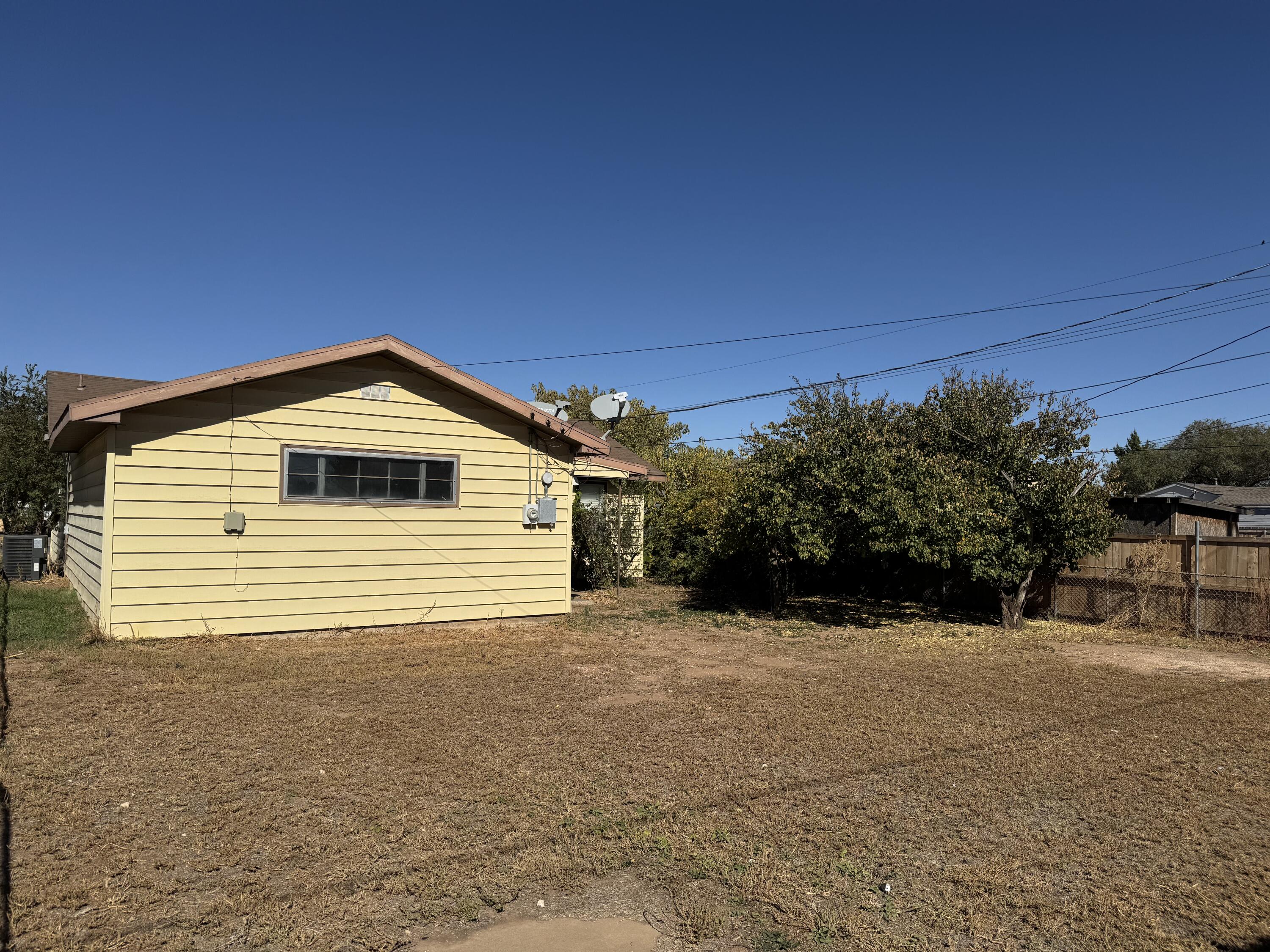 3103 Harvard Street Lubbock, TX 79415 - Photo 15 of 16 a view of a house with a yard