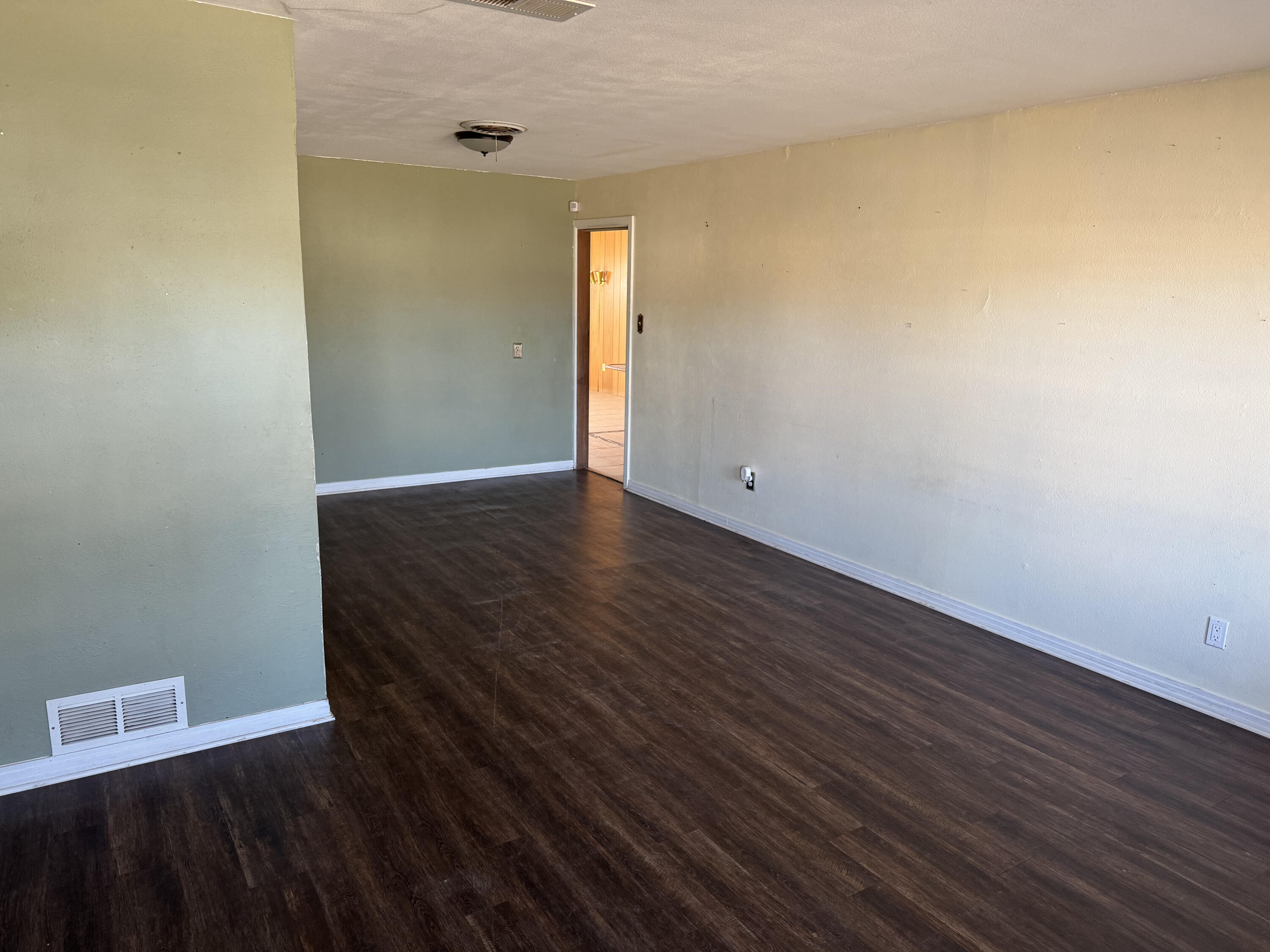 3103 Harvard Street Lubbock, TX 79415 - Photo 3 of 16 wooden floor in a empty room
