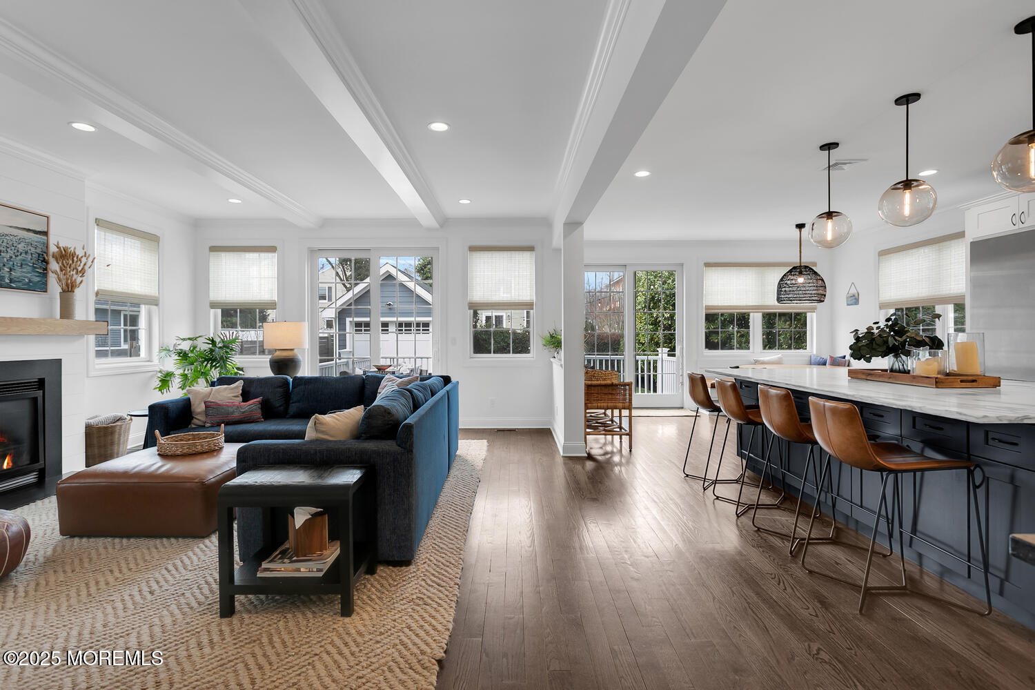 86 Washington Street Rumson, NJ 07760 - Photo 12 of 43 a living room with furniture a fireplace and a dining table
