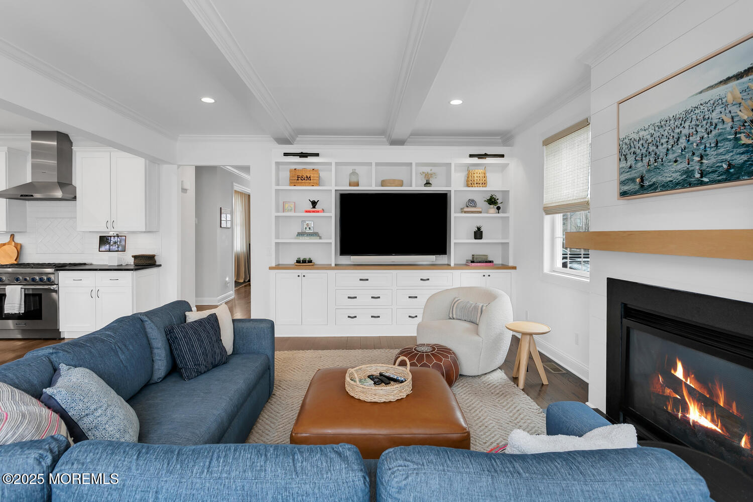 86 Washington Street Rumson, NJ 07760 - Photo 13 of 43 a living room with furniture a flat screen tv and a fireplace