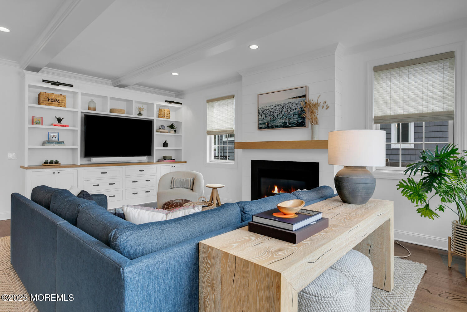 86 Washington Street Rumson, NJ 07760 - Photo 15 of 43 a living room with furniture a flat screen tv and a fireplace