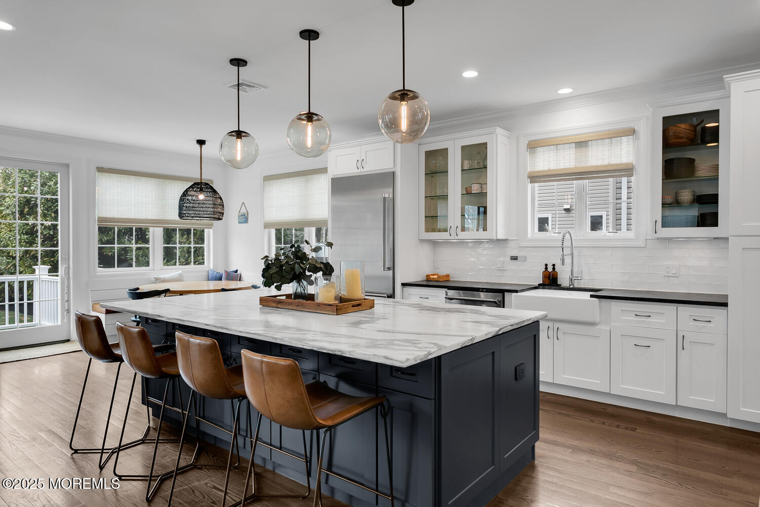 86 Washington Street Rumson, NJ 07760 - Photo 18 of 43 a kitchen with stainless steel appliances granite countertop a sink a stove a dining table and chairs