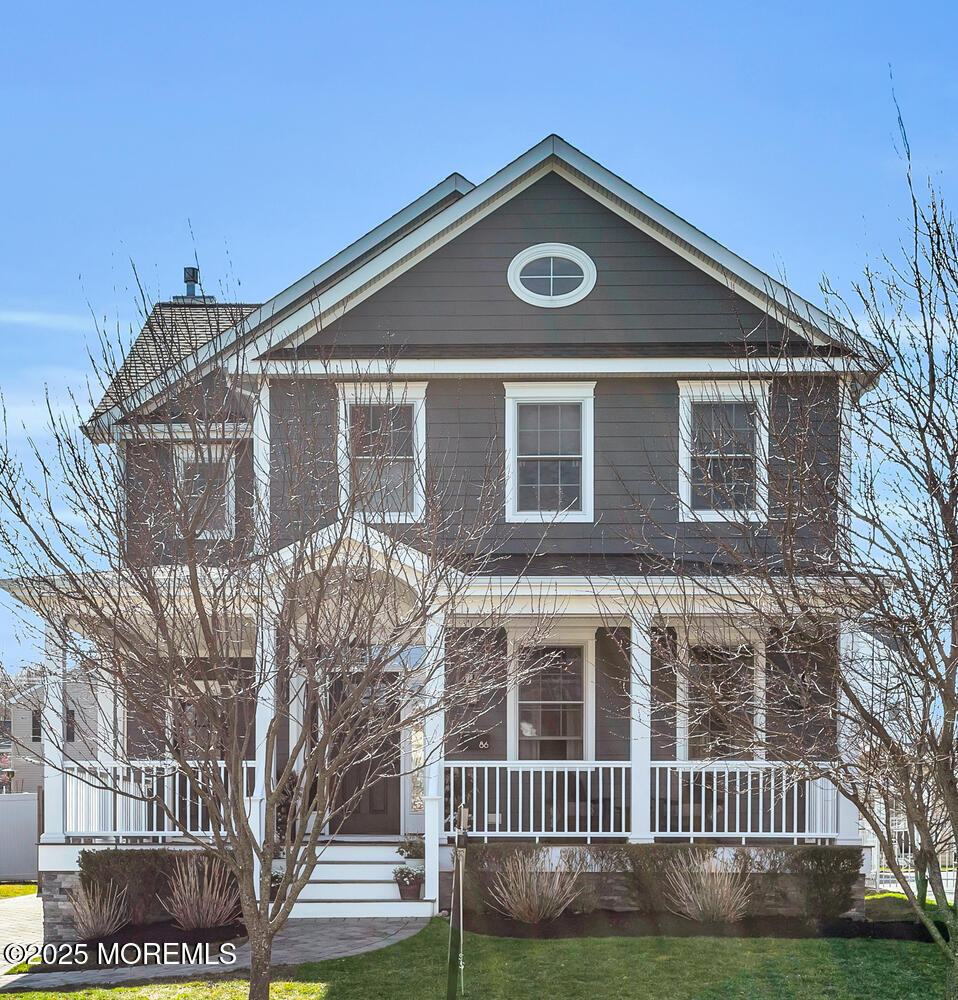 86 Washington Street Rumson, NJ 07760 - Photo 2 of 43 a front view of a house with a yard
