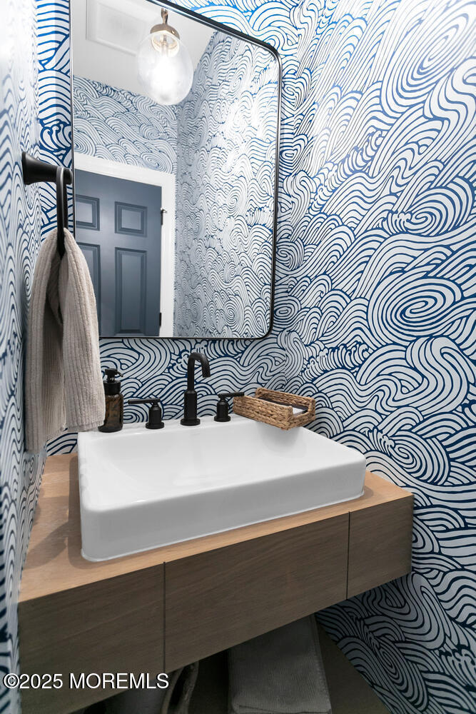 86 Washington Street Rumson, NJ 07760 - Photo 24 of 43 a bedroom with a bed and a mirror