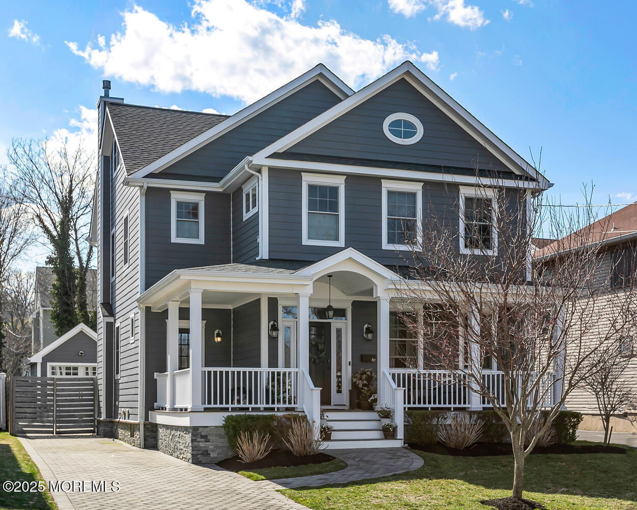 86 Washington Street Rumson, NJ 07760 - Photo 3 of 43 a front view of a house with garden