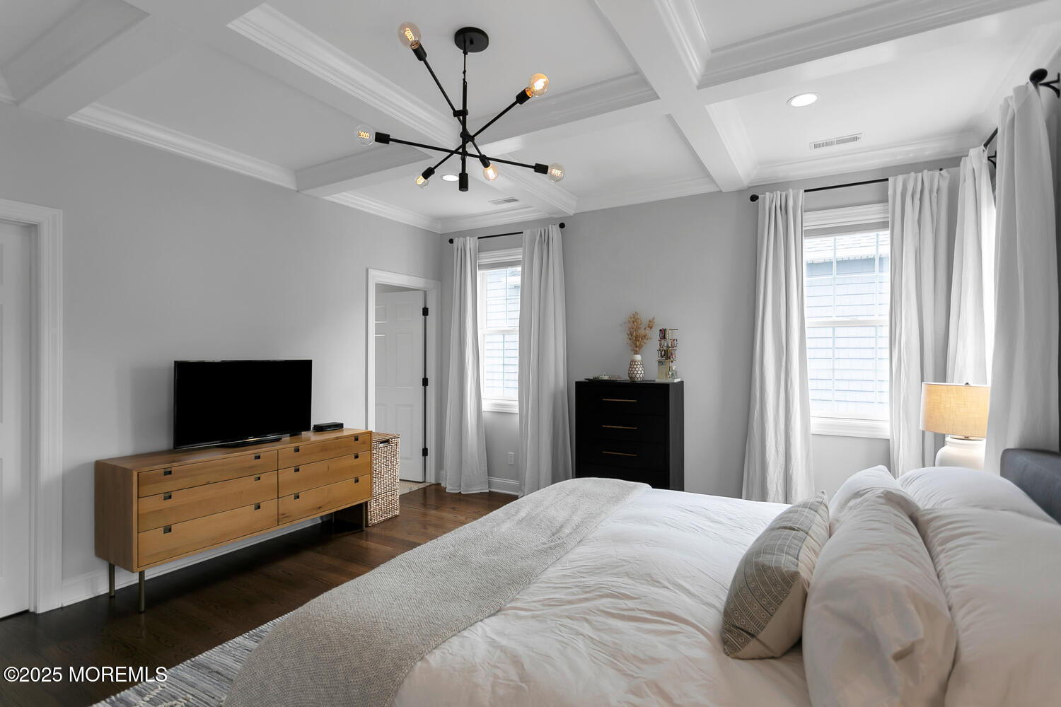 86 Washington Street Rumson, NJ 07760 - Photo 31 of 43 a bedroom with a bed and a flat tv screen on dresser