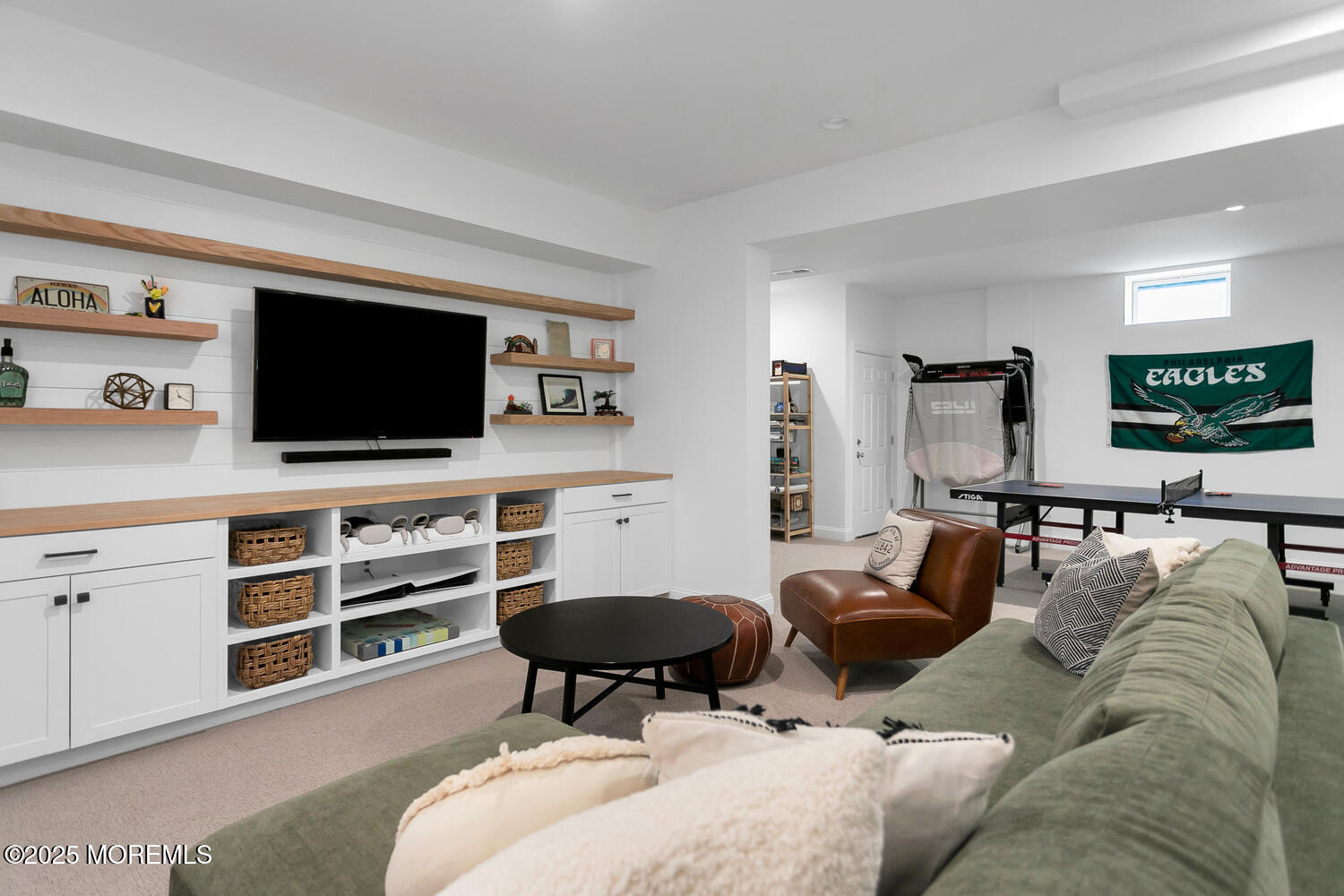 86 Washington Street Rumson, NJ 07760 - Photo 33 of 43 a living room with furniture a flat screen tv and kitchen view