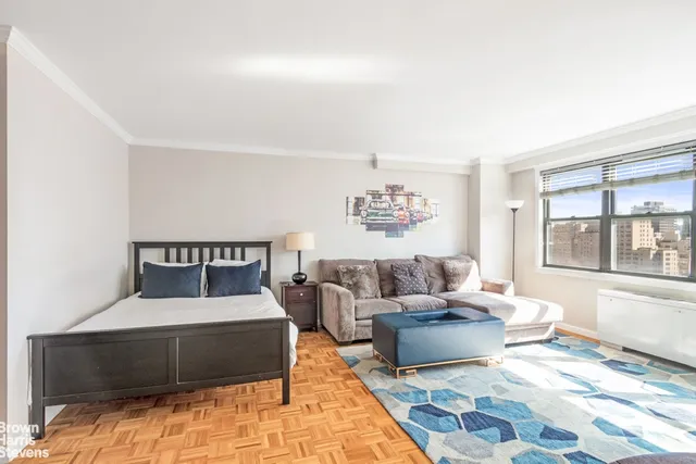 a living room with furniture and a window