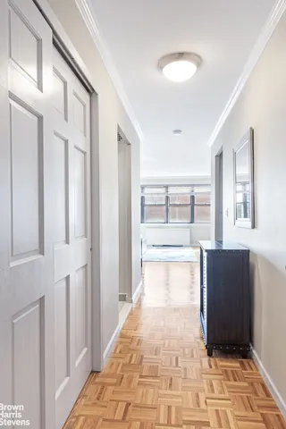 a living room with a couch and a window