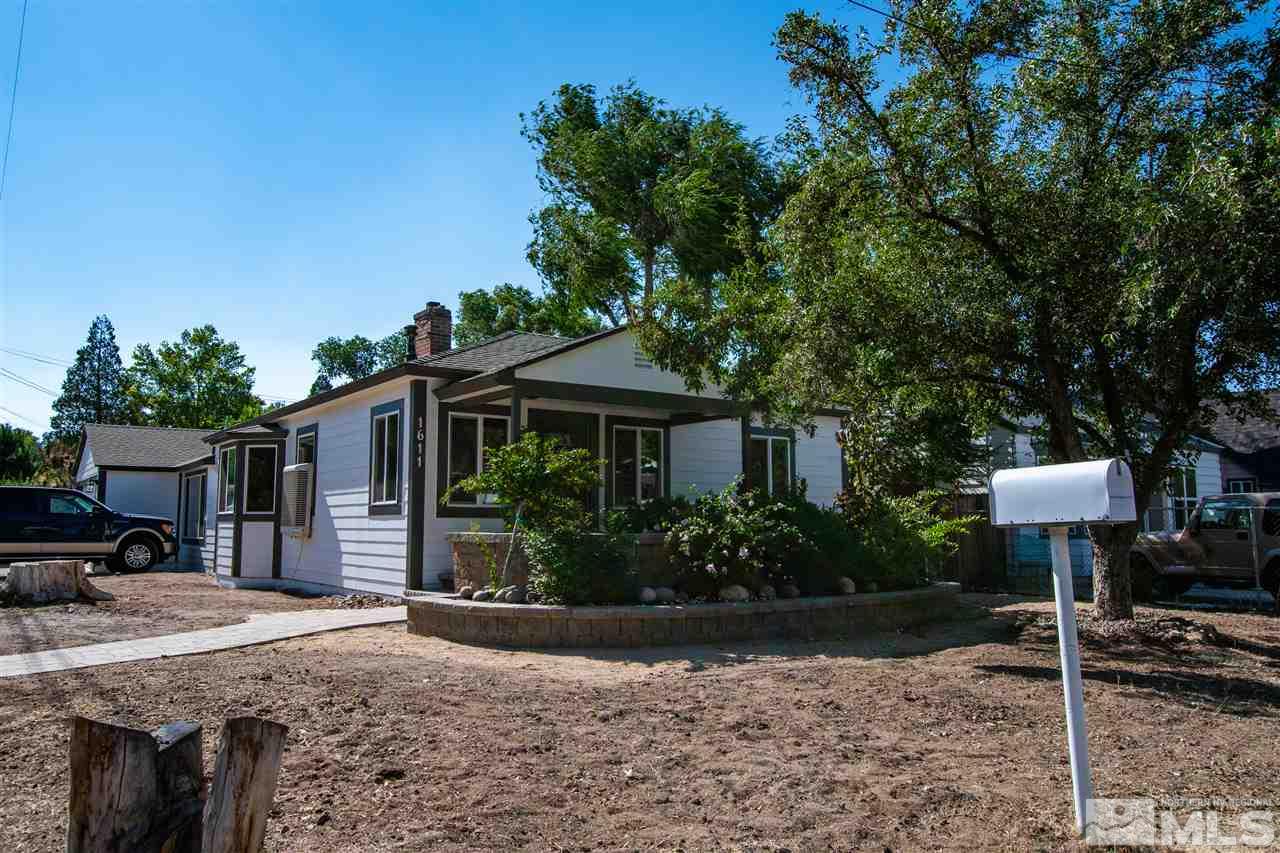 1611 Plumas Street Reno, NV 89509 - Photo 1 of 25 a front view of a house with garden
