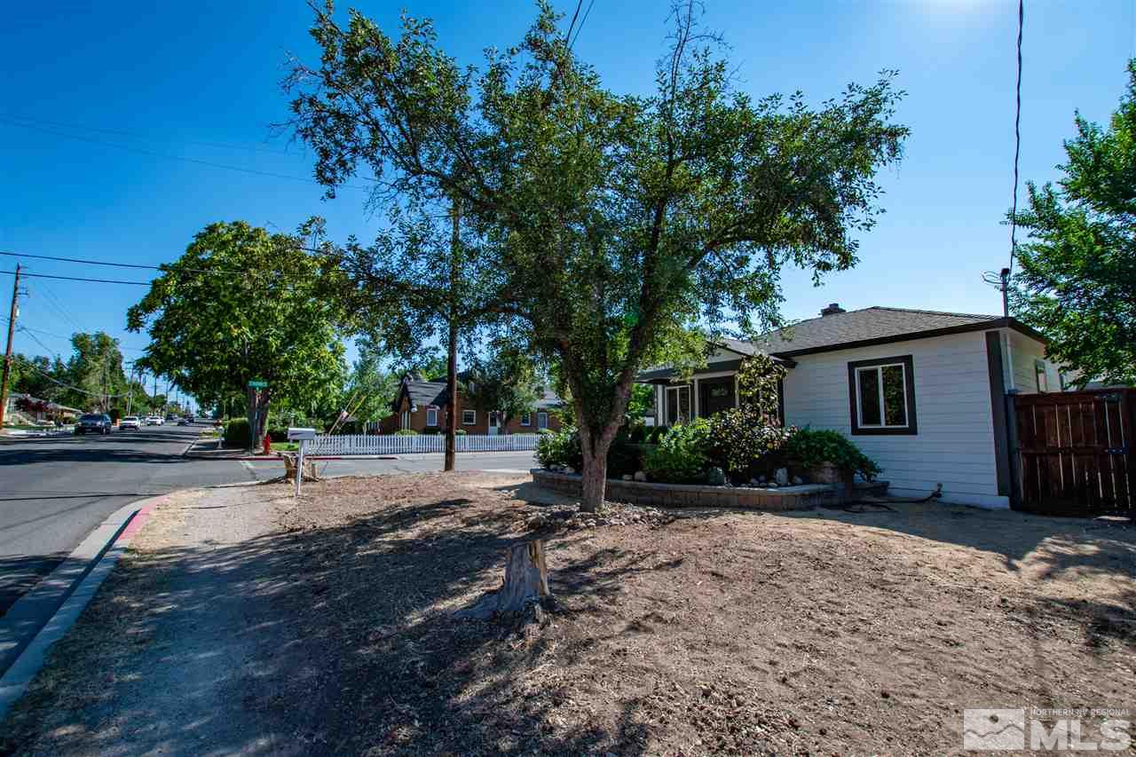 1611 Plumas Street Reno, NV 89509 - Photo 3 of 25 a view of a backyard with a garden and trees