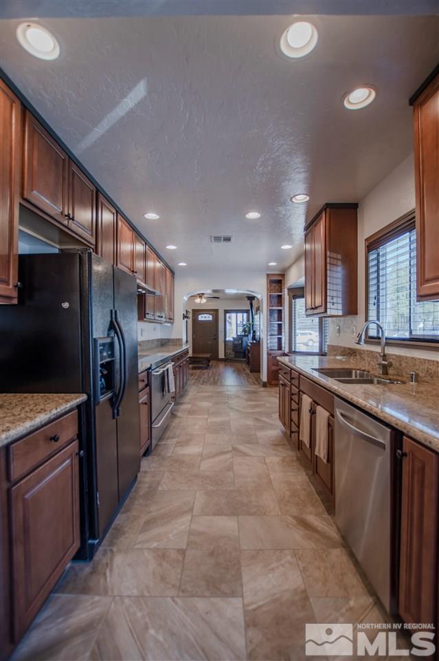 1611 Plumas Street Reno, NV 89509 - Photo 6 of 25 a large kitchen with stainless steel appliances lots of counter top space