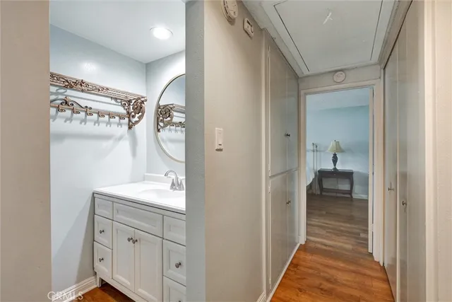 a en suite bathroom with a sink a mirror and a shower