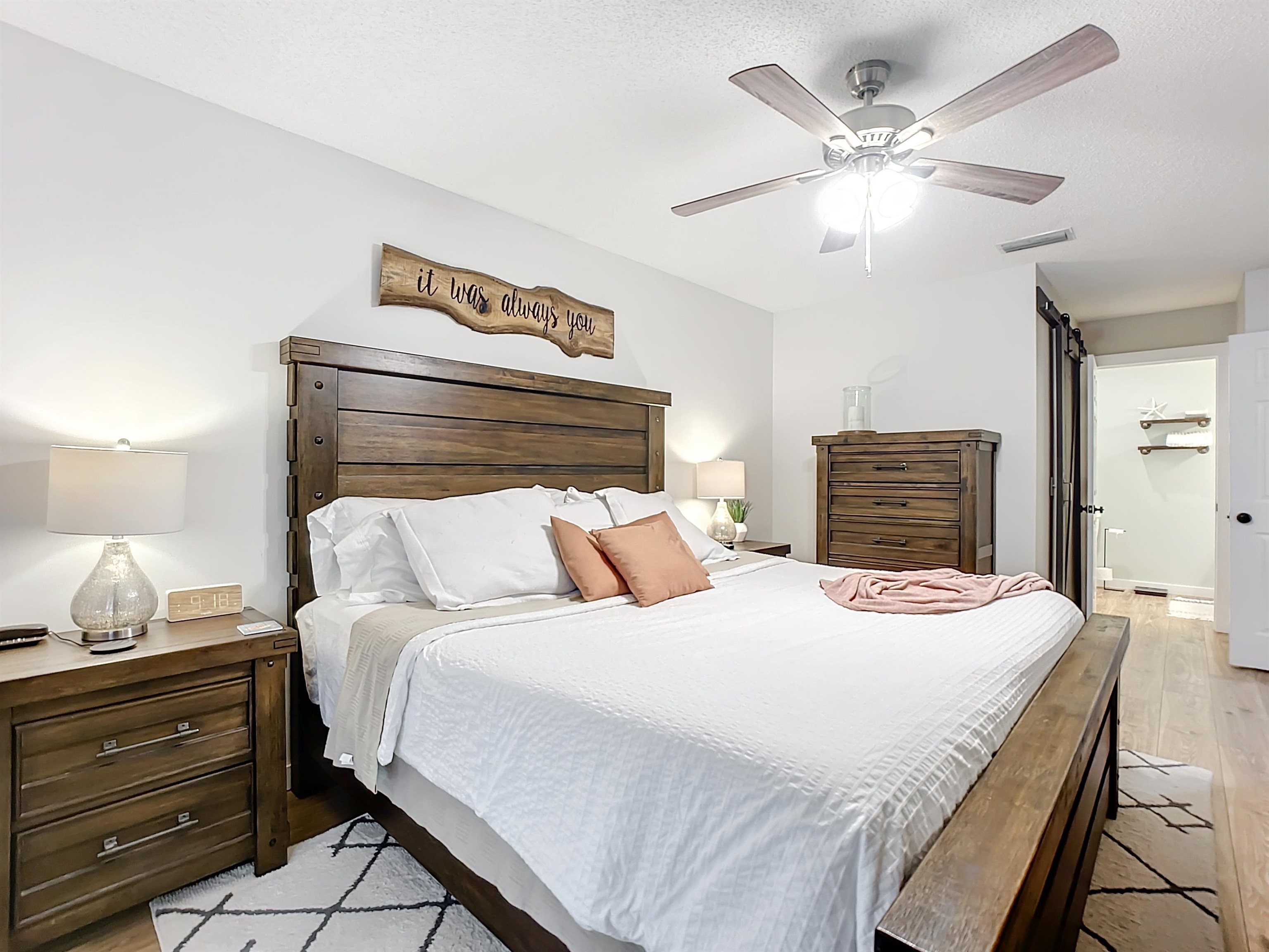 136 Pelican Road St. Augustine, FL 32086 - Photo 21 of 45 a bedroom with a bed and a chandelier