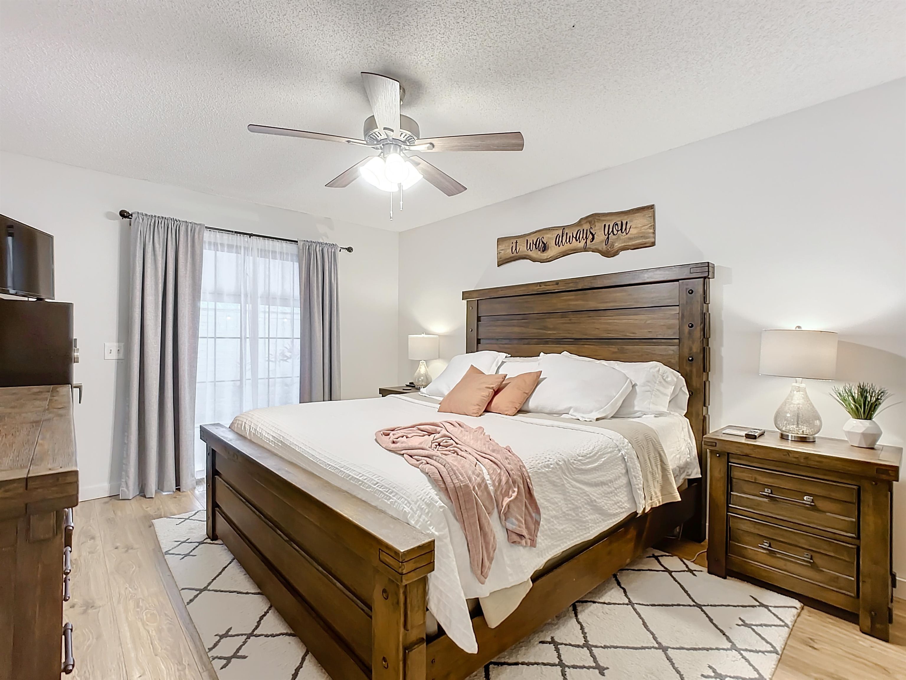 136 Pelican Road St. Augustine, FL 32086 - Photo 22 of 45 a bedroom with a bed and a flat tv screen on dresser