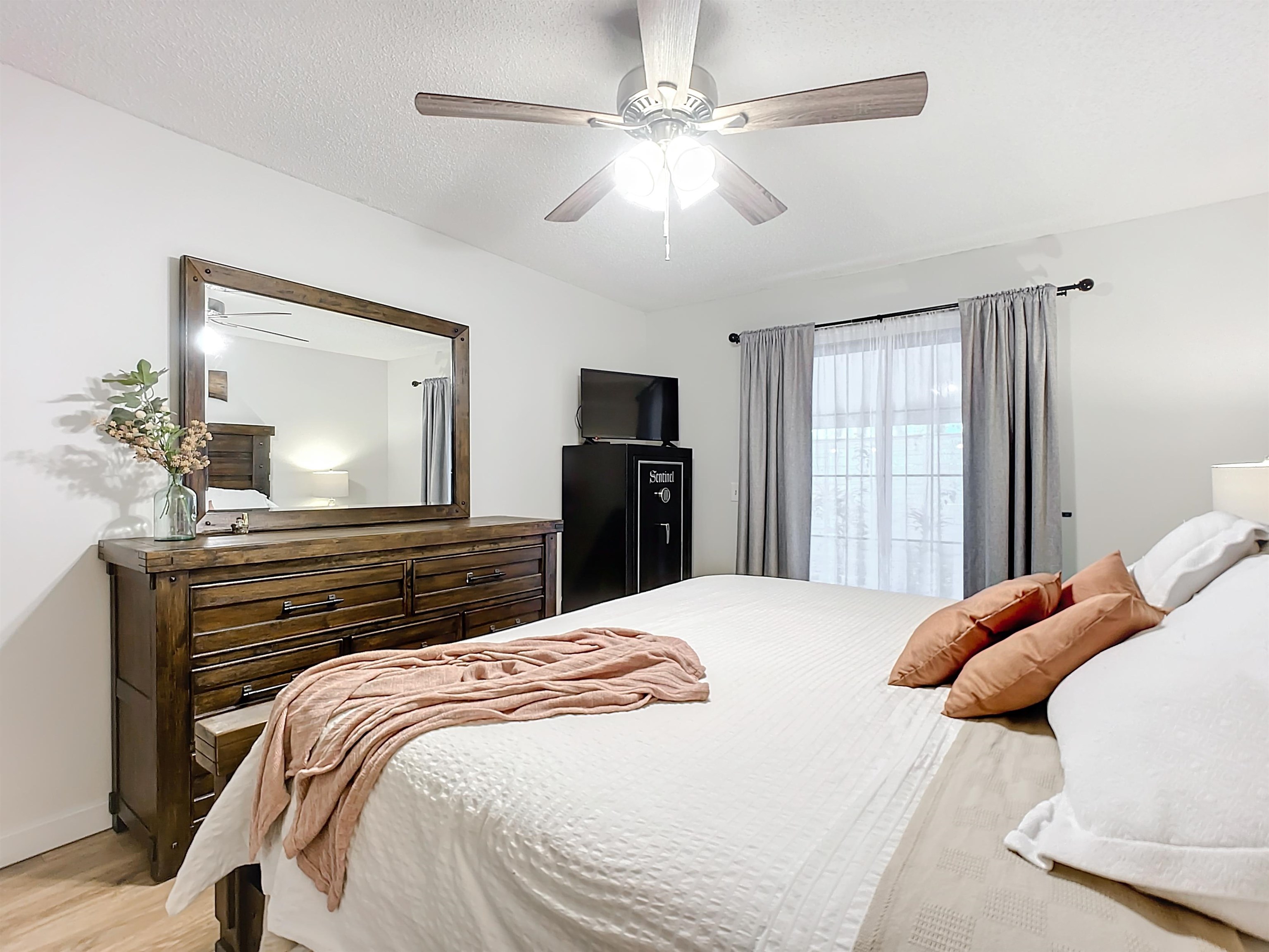 136 Pelican Road St. Augustine, FL 32086 - Photo 23 of 45 a bedroom with a bed and a chandelier