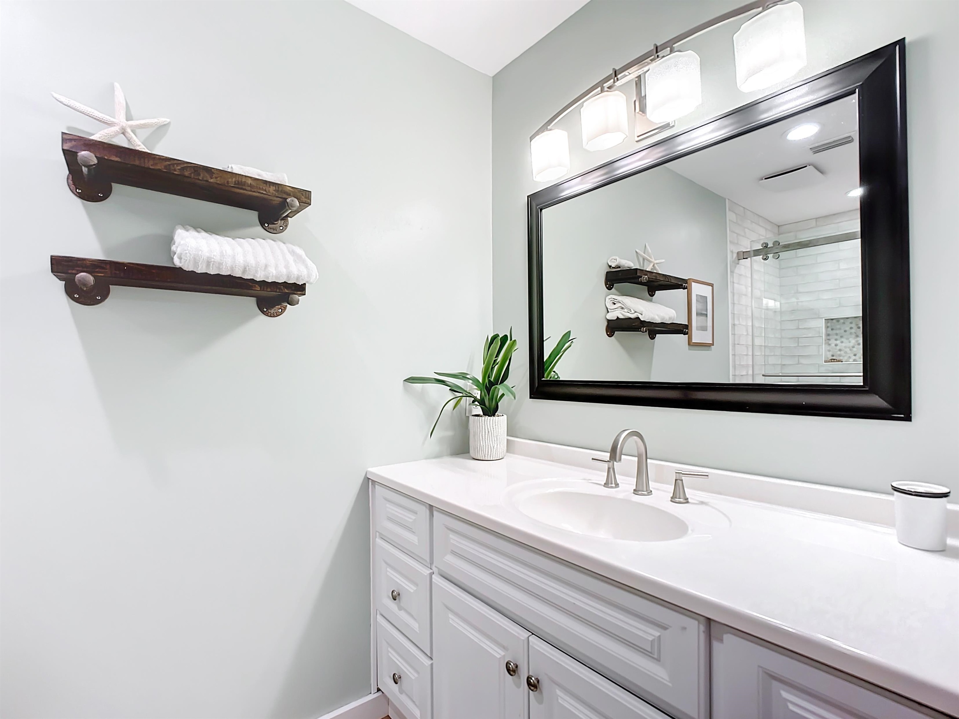 136 Pelican Road St. Augustine, FL 32086 - Photo 24 of 45 a bathroom with a sink and a mirror