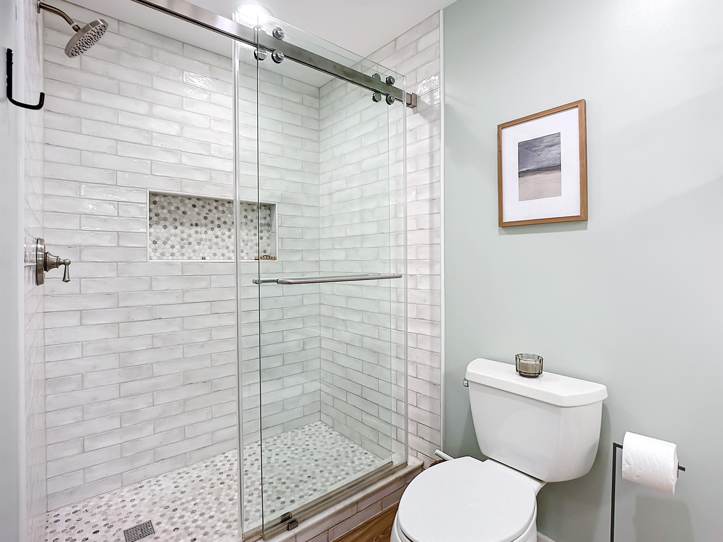 136 Pelican Road St. Augustine, FL 32086 - Photo 25 of 45 a white toilet sitting next to a bathroom shower