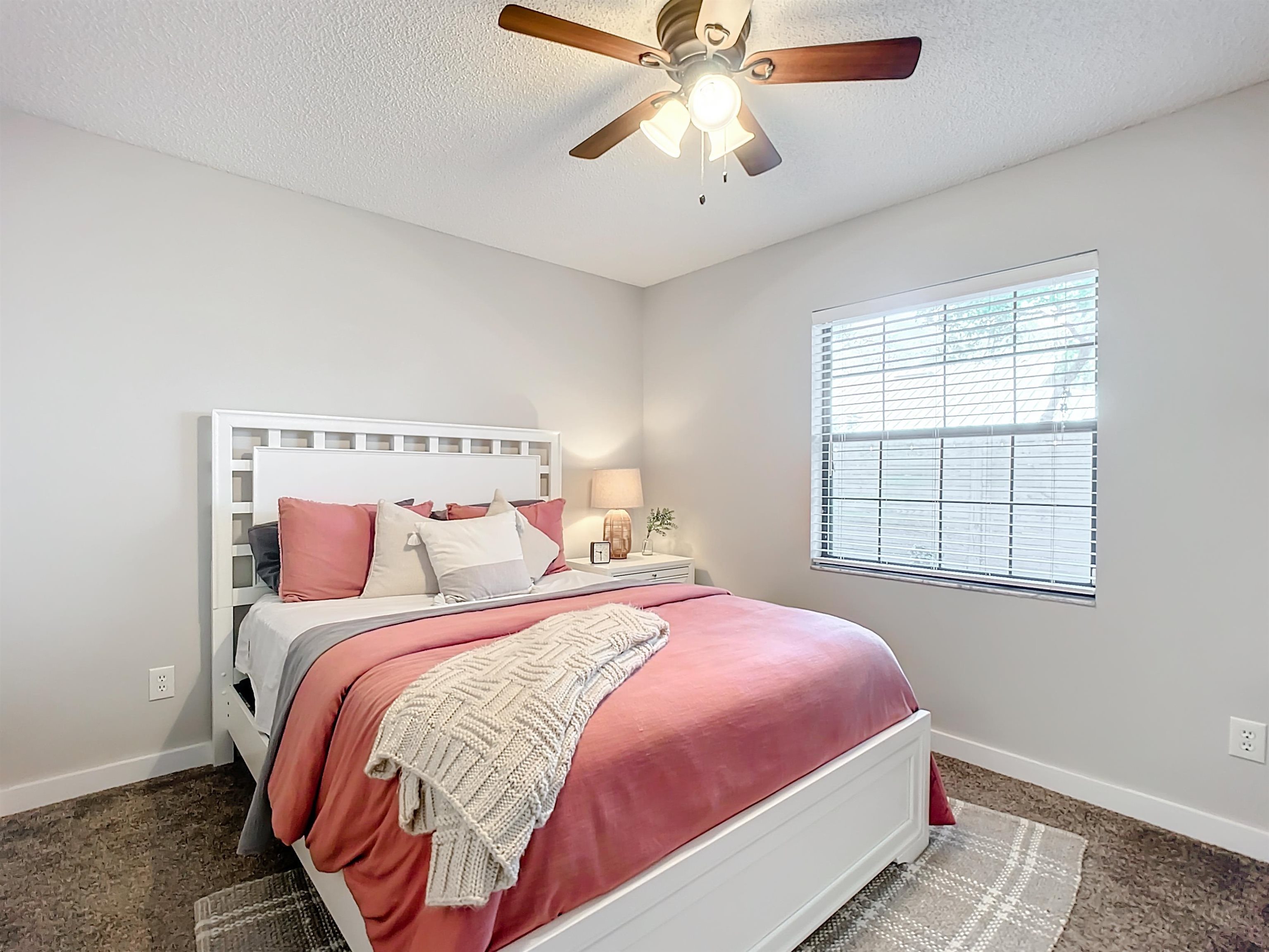 136 Pelican Road St. Augustine, FL 32086 - Photo 27 of 45 a bedroom with a bed and a chandelier