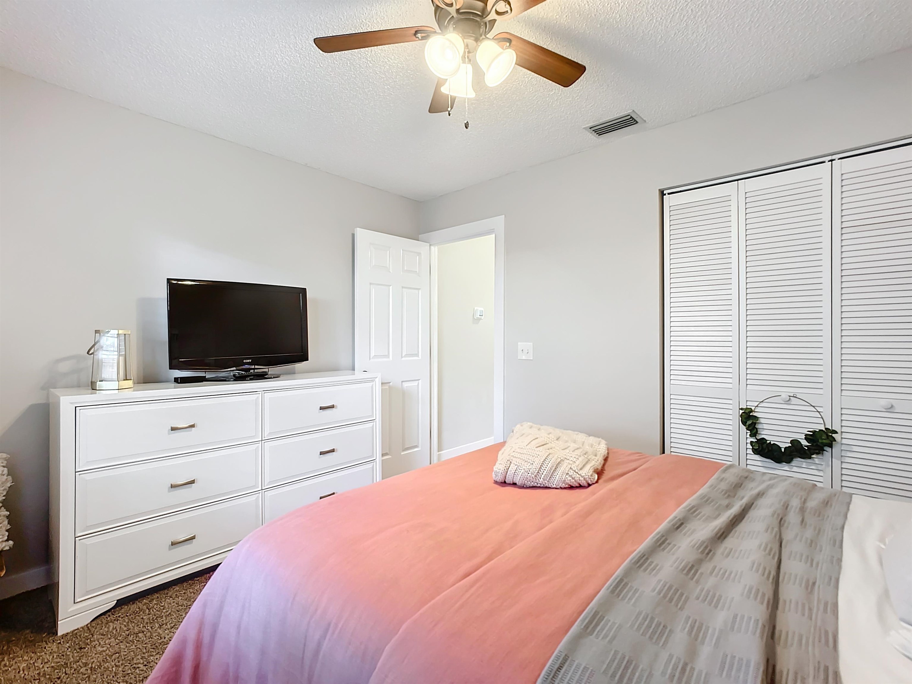 136 Pelican Road St. Augustine, FL 32086 - Photo 29 of 45 a bedroom with a bed and a flat screen tv
