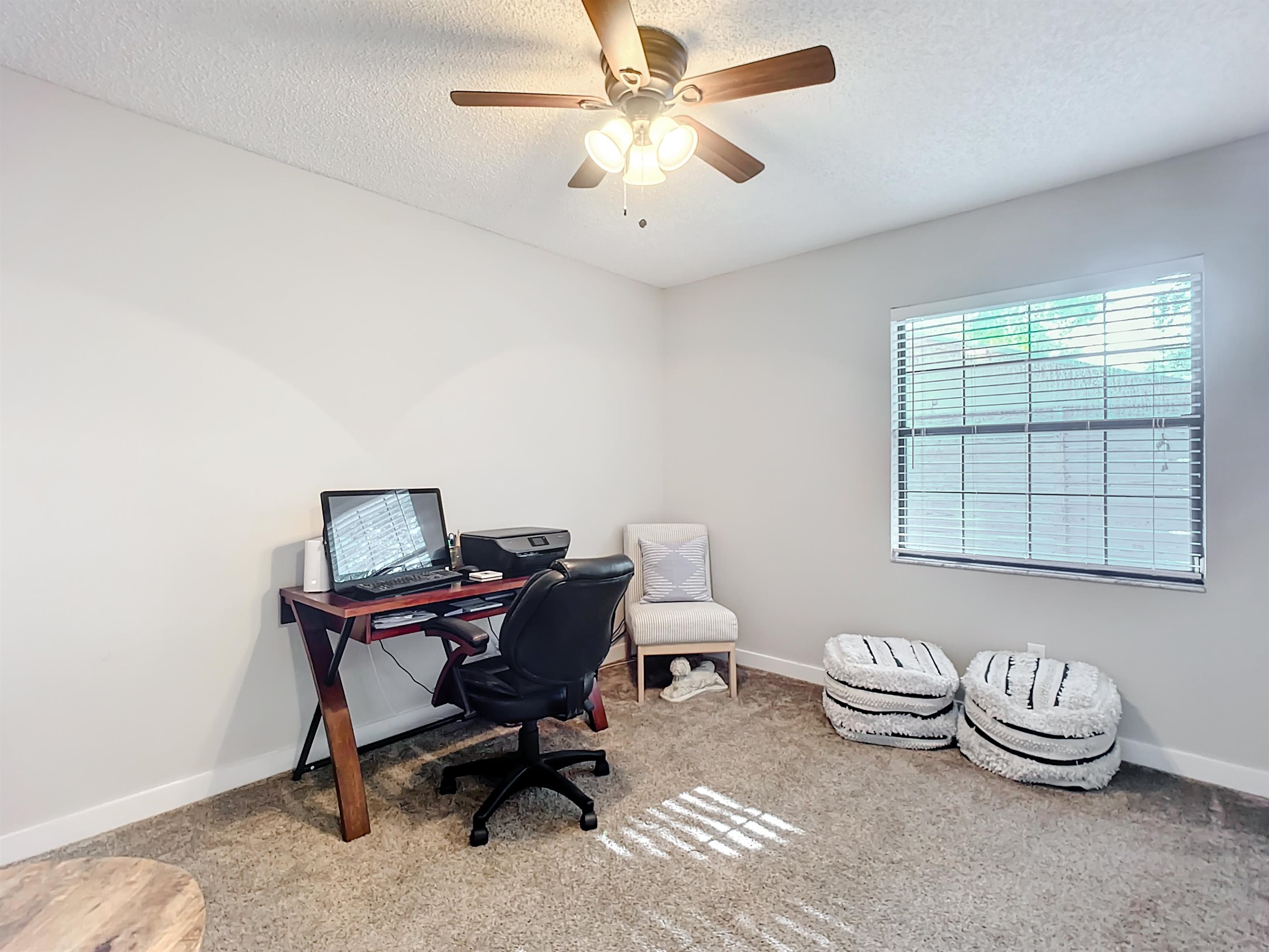 136 Pelican Road St. Augustine, FL 32086 - Photo 31 of 45 a view of a workspace with furniture and a window