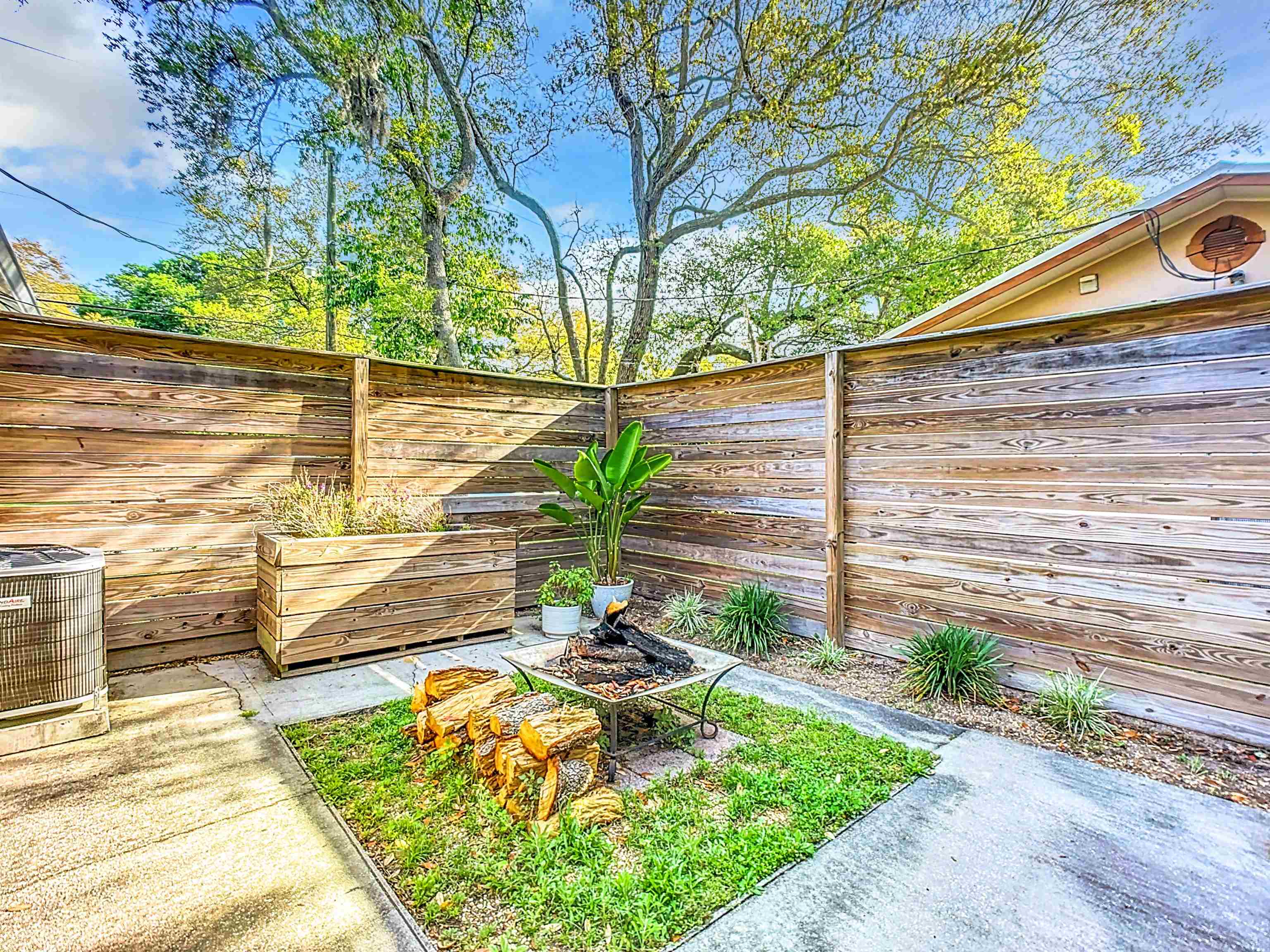 136 Pelican Road St. Augustine, FL 32086 - Photo 41 of 45 a backyard of a house with lots of green space and outdoor seating