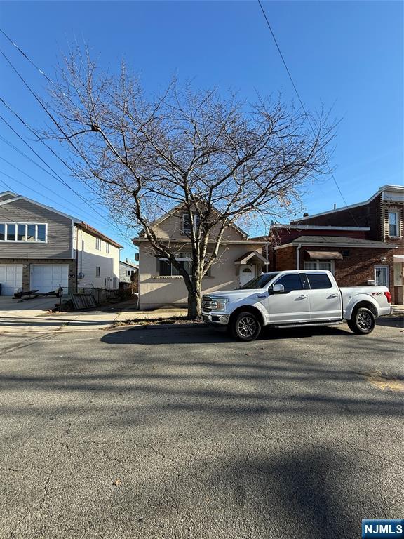 16 Corabelle Avenue Lodi, NJ 07644 - Photo 17 of 20 a view of a car parked on the side of the road