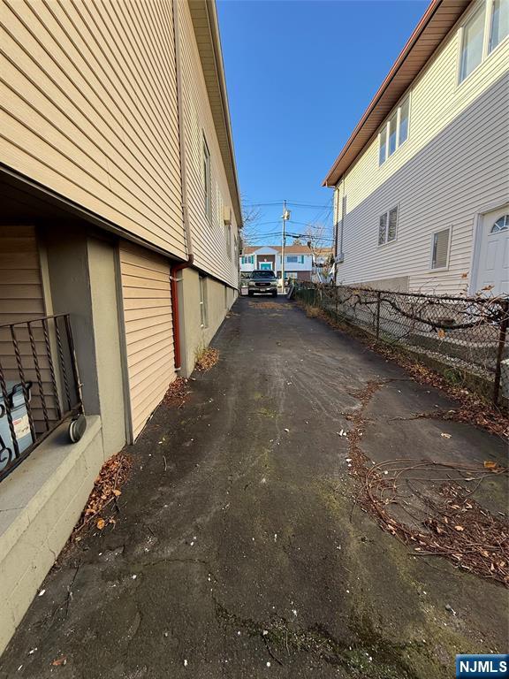 16 Corabelle Avenue Lodi, NJ 07644 - Photo 18 of 20 a view of a road with wooden fence