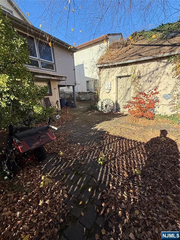 16 Corabelle Avenue Lodi, NJ 07644 - Photo 20 of 20 a view of a backyard with pathway