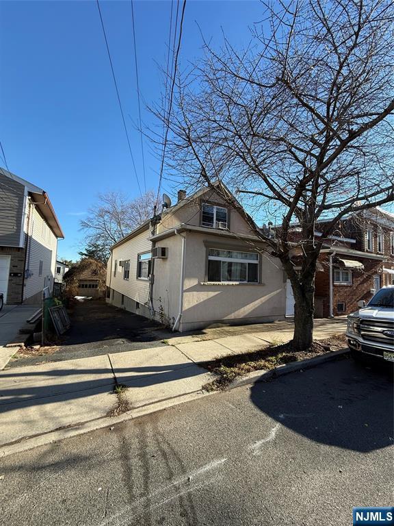 16 Corabelle Avenue Lodi, NJ 07644 - Photo 2 of 20 a front view of a house with a yard