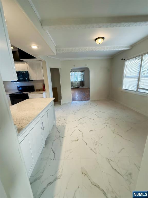 16 Corabelle Avenue Lodi, NJ 07644 - Photo 4 of 20 a view of a kitchen with a sink and a stove top oven