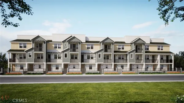 front view of a large building with a yard