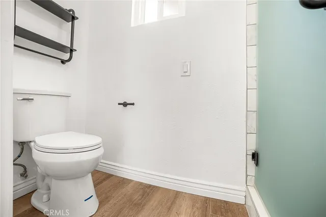 a bathroom with a toilet and a bathtub