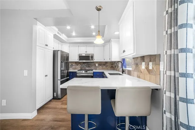 a view of a kitchen with furniture and chandelier