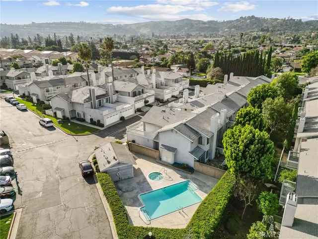 an aerial view of residential houses with outdoor space