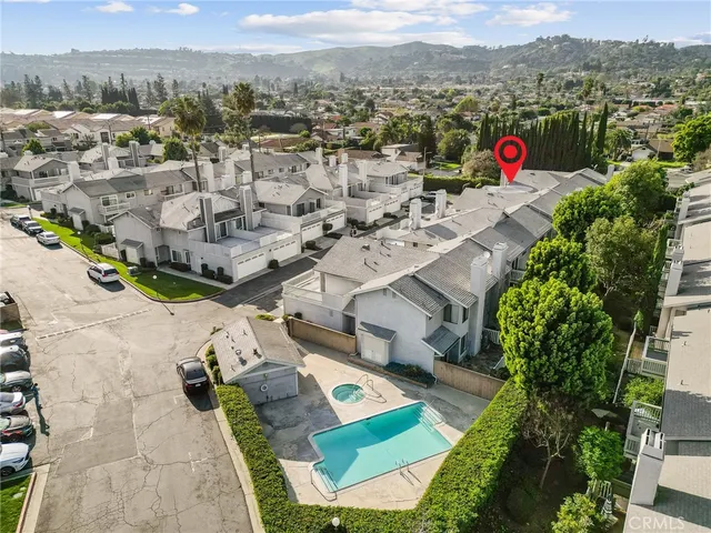 an aerial view of residential houses with outdoor space