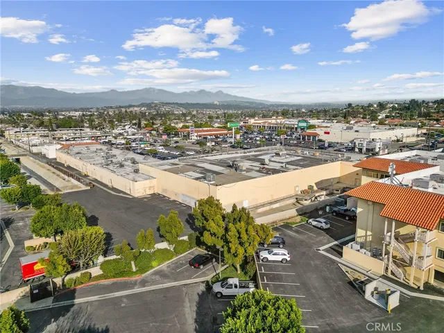 an aerial view of a house with yard