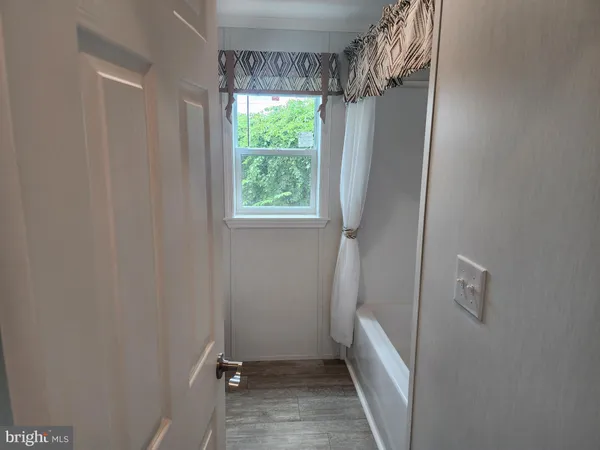 a view of room with window and shower