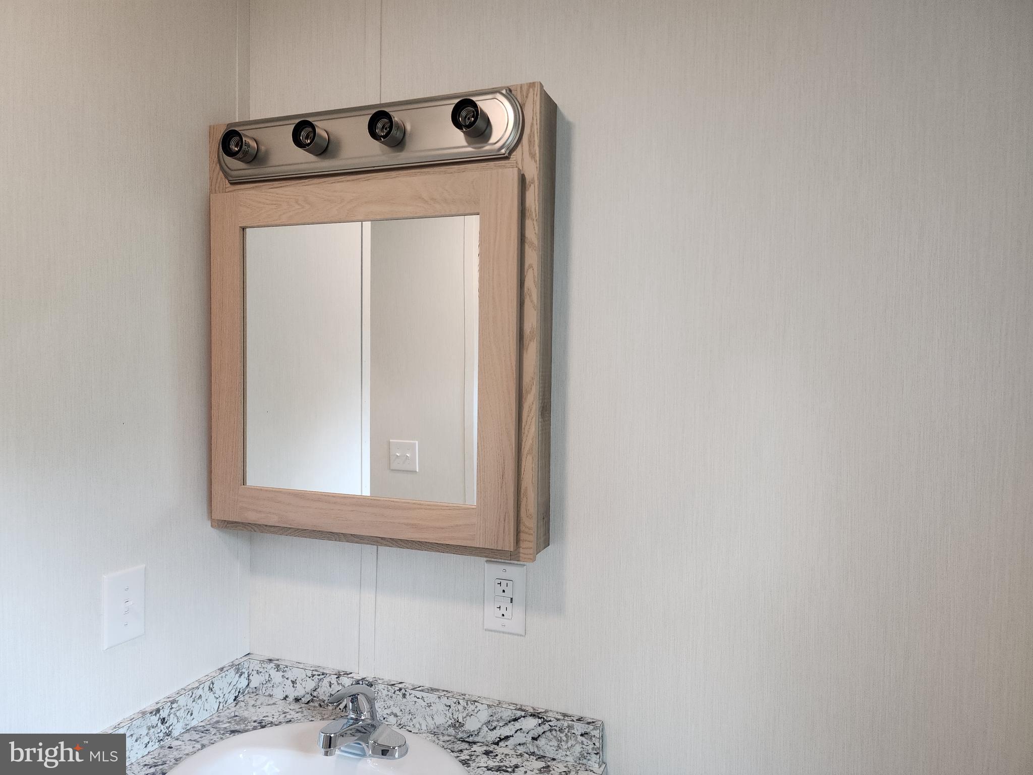 165 West Ridge Pike Limerick, PA 19468 - Photo 15 of 15 a bathroom with a sink and a mirror
