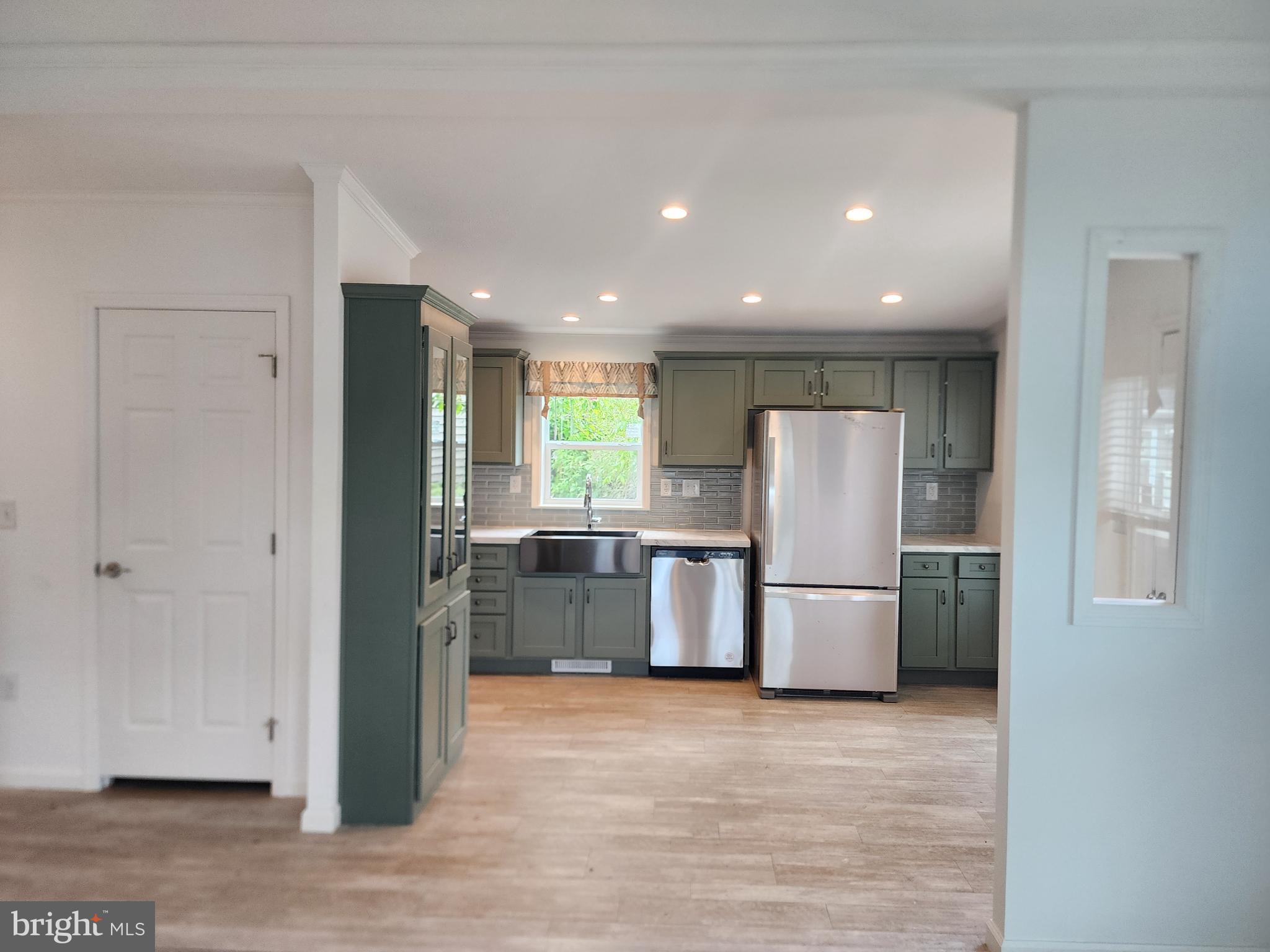 165 West Ridge Pike Limerick, PA 19468 - Photo 2 of 15 a kitchen with a refrigerator and a stove top oven