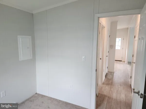 a view of a bathroom from the hallway