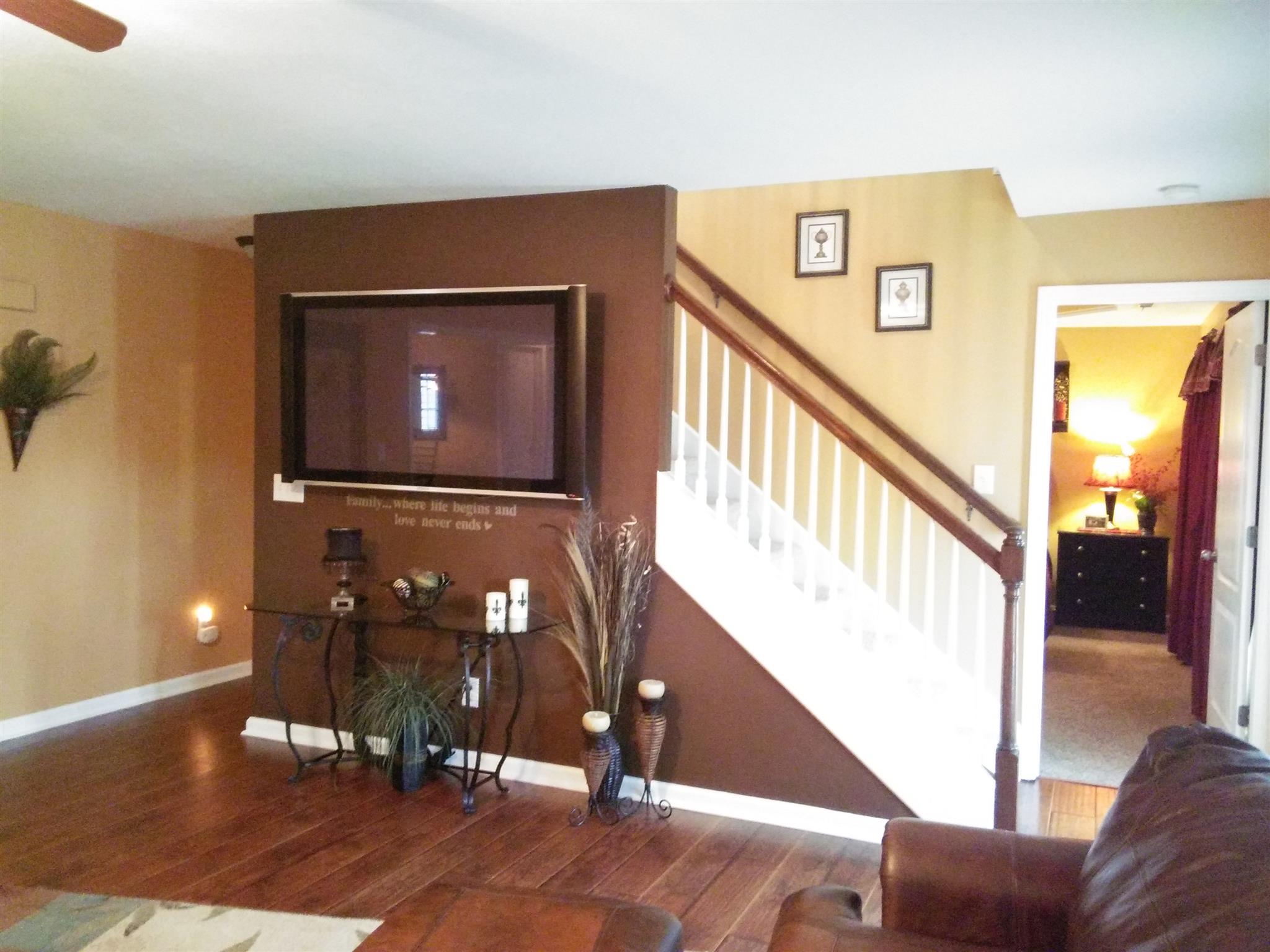 1040 Drake Road Clarksville, TN 37043 - Photo 11 of 29 a view of a hallway with wooden floor and staircase