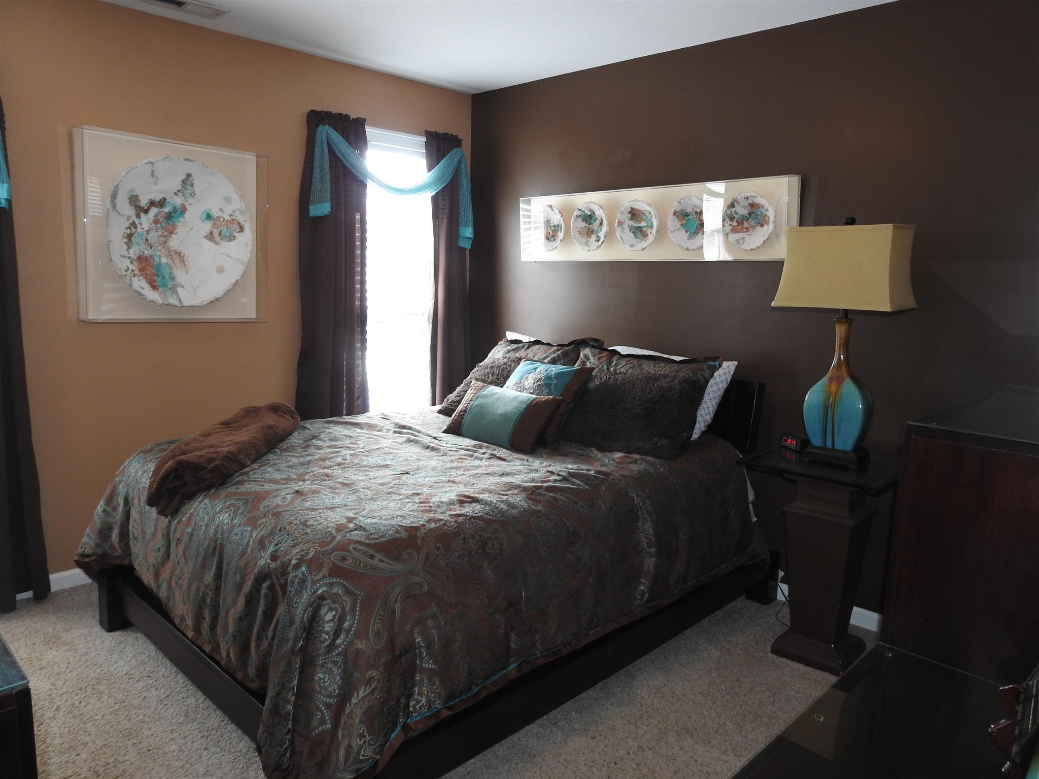 1040 Drake Road Clarksville, TN 37043 - Photo 19 of 29 a bedroom with a bed and painting on the wall
