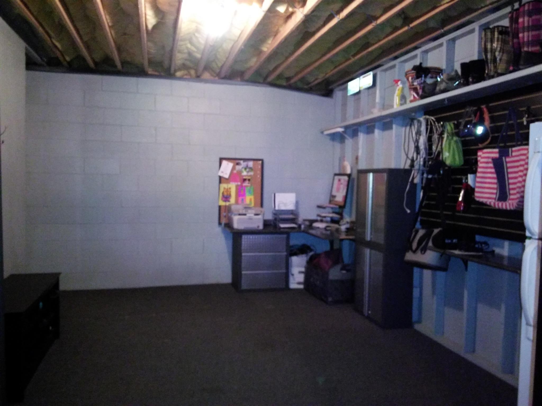 1040 Drake Road Clarksville, TN 37043 - Photo 22 of 29 a room with furniture and a refrigerator